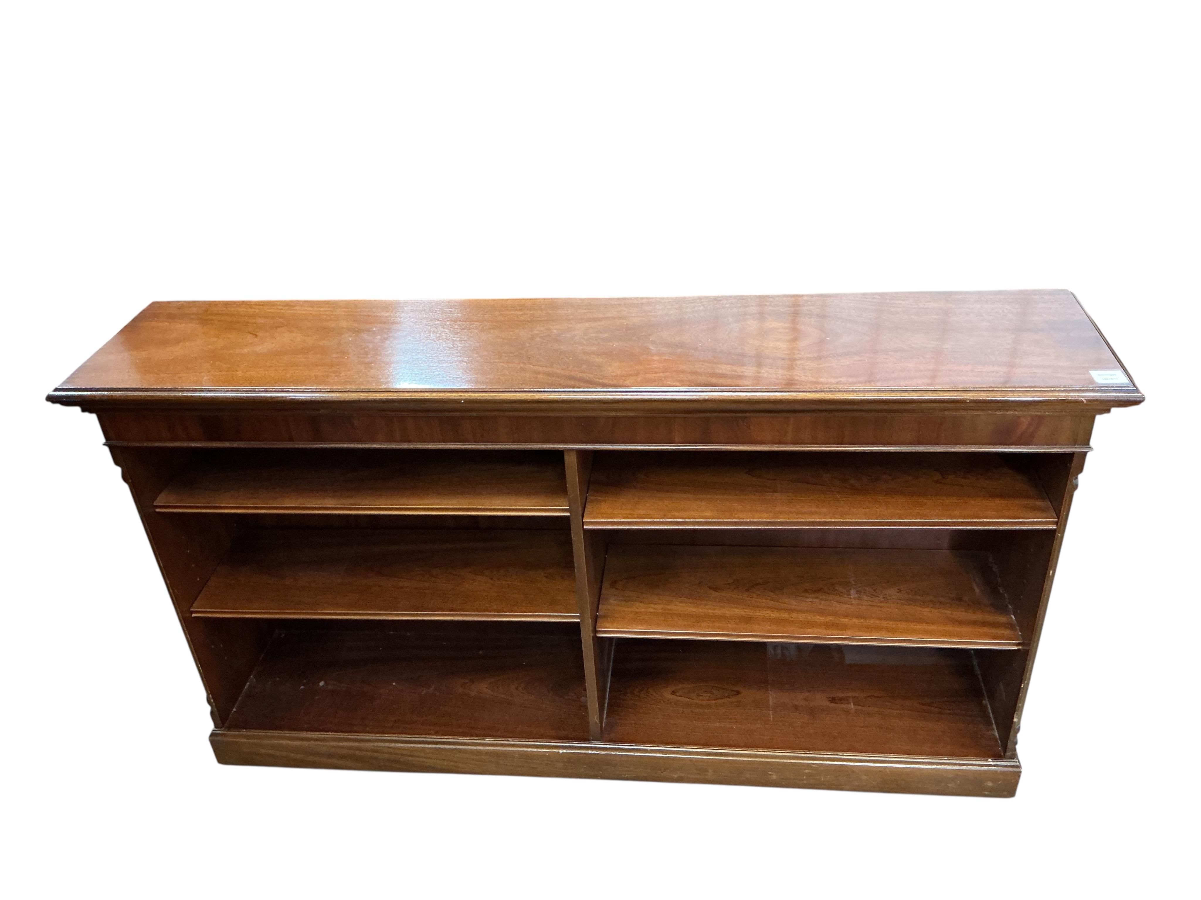 A reproduction mahogany dwarf open bookcase, width 152cm, depth 32cm, height 86cm